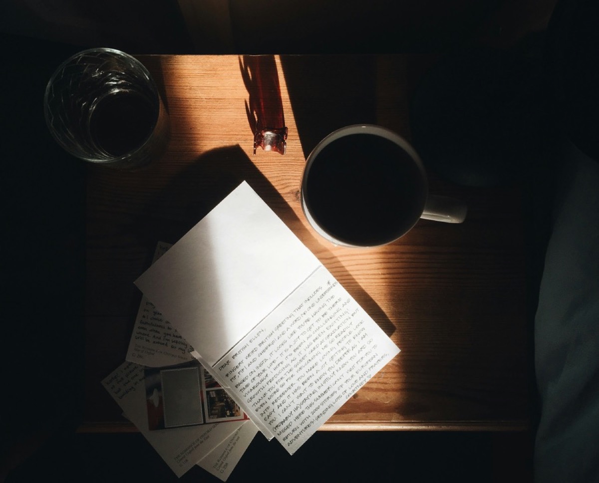 A notebook and coffee on a desk